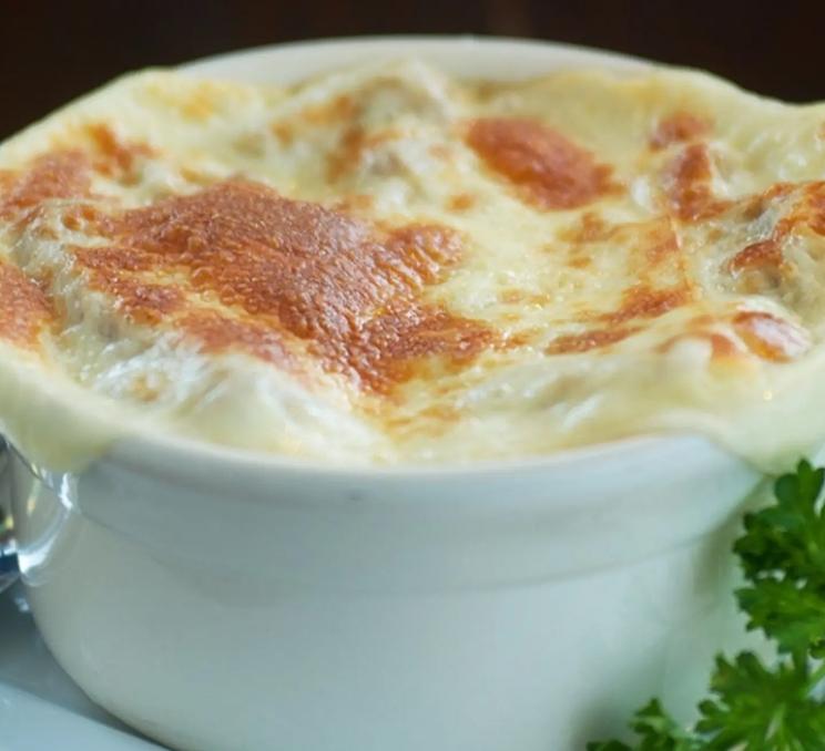 A bowl with melted cheese on it at The Old Spaghetti Factory in Victoria, BC