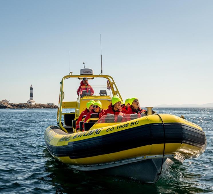 A zodiac tour explores near Race Rocks island in Victoria, BC