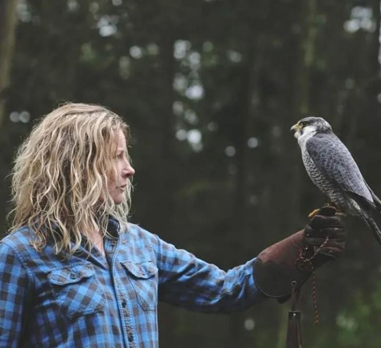 A woman and a falcon at The Raptors in Greater Victoria, BC