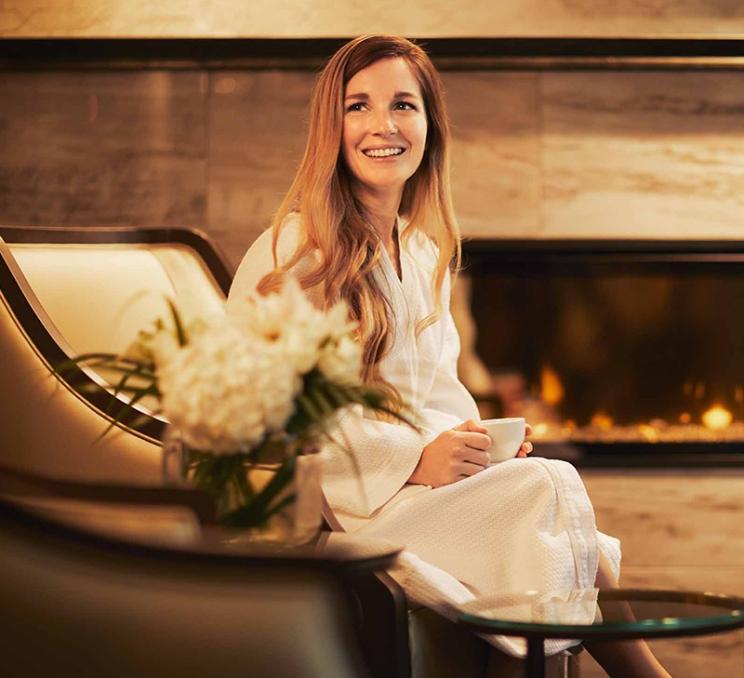 A woman enjoys a cup of tea at the Willow Stream Spa in Victoria, BC