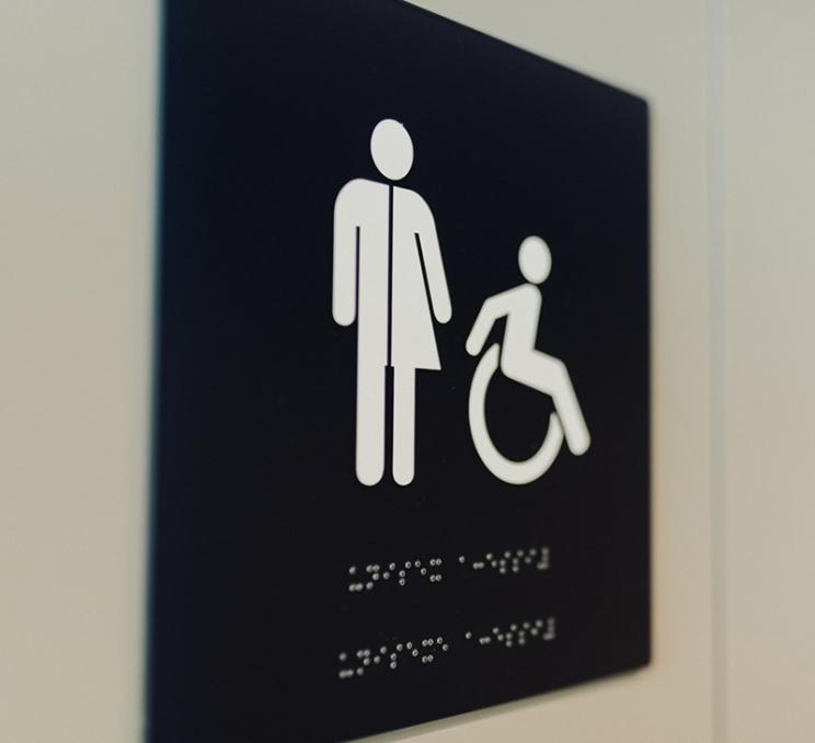 A sign for an accessible bathroom facility in Victoria, BC