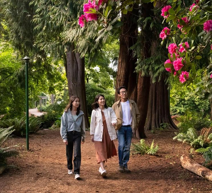 A family explores Beacon Hill Park in Victoria, BC