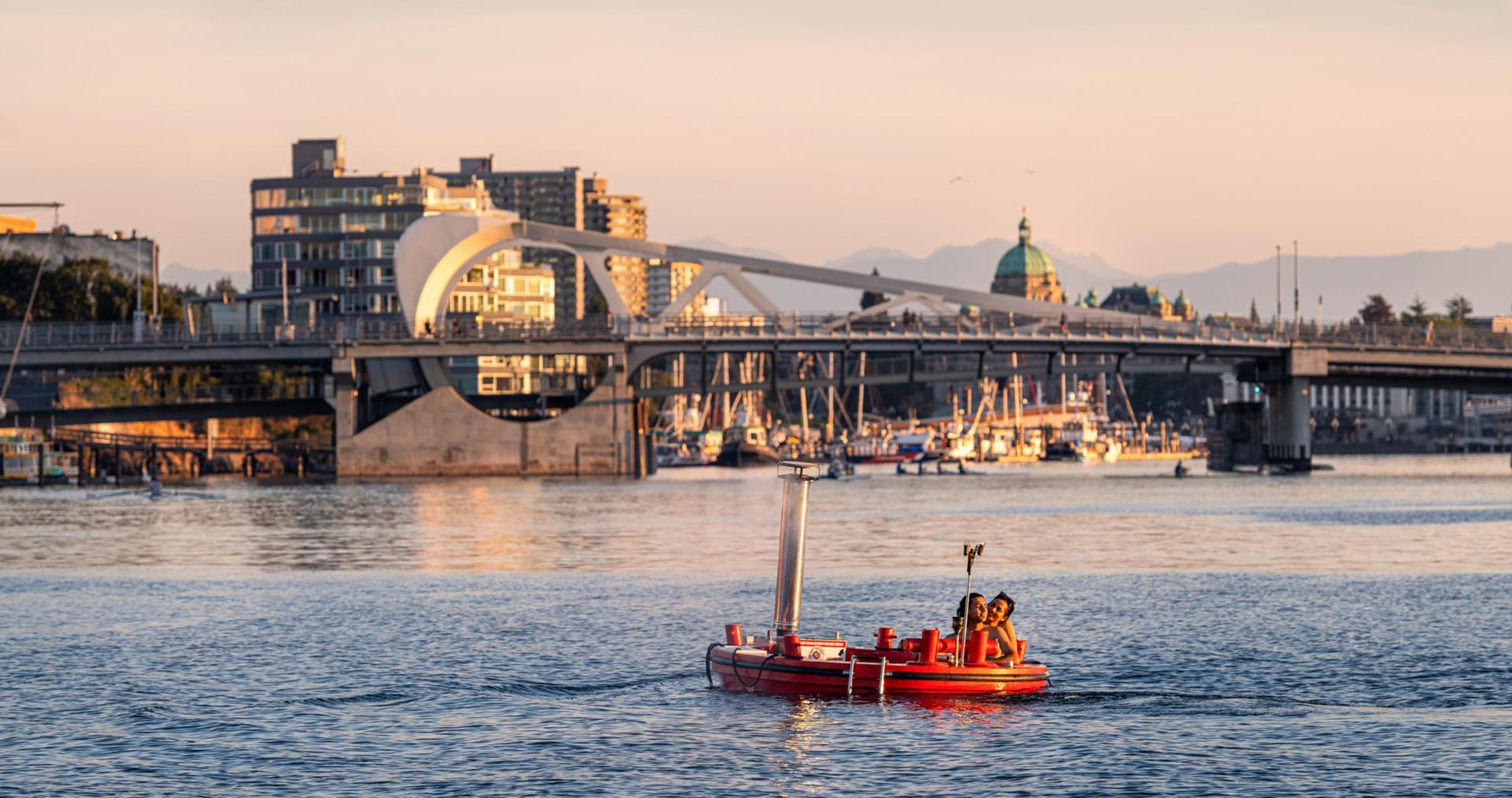 A couple floats around Victoria's Upper Harbour in a Hot Tub Boat in Victoria, BC