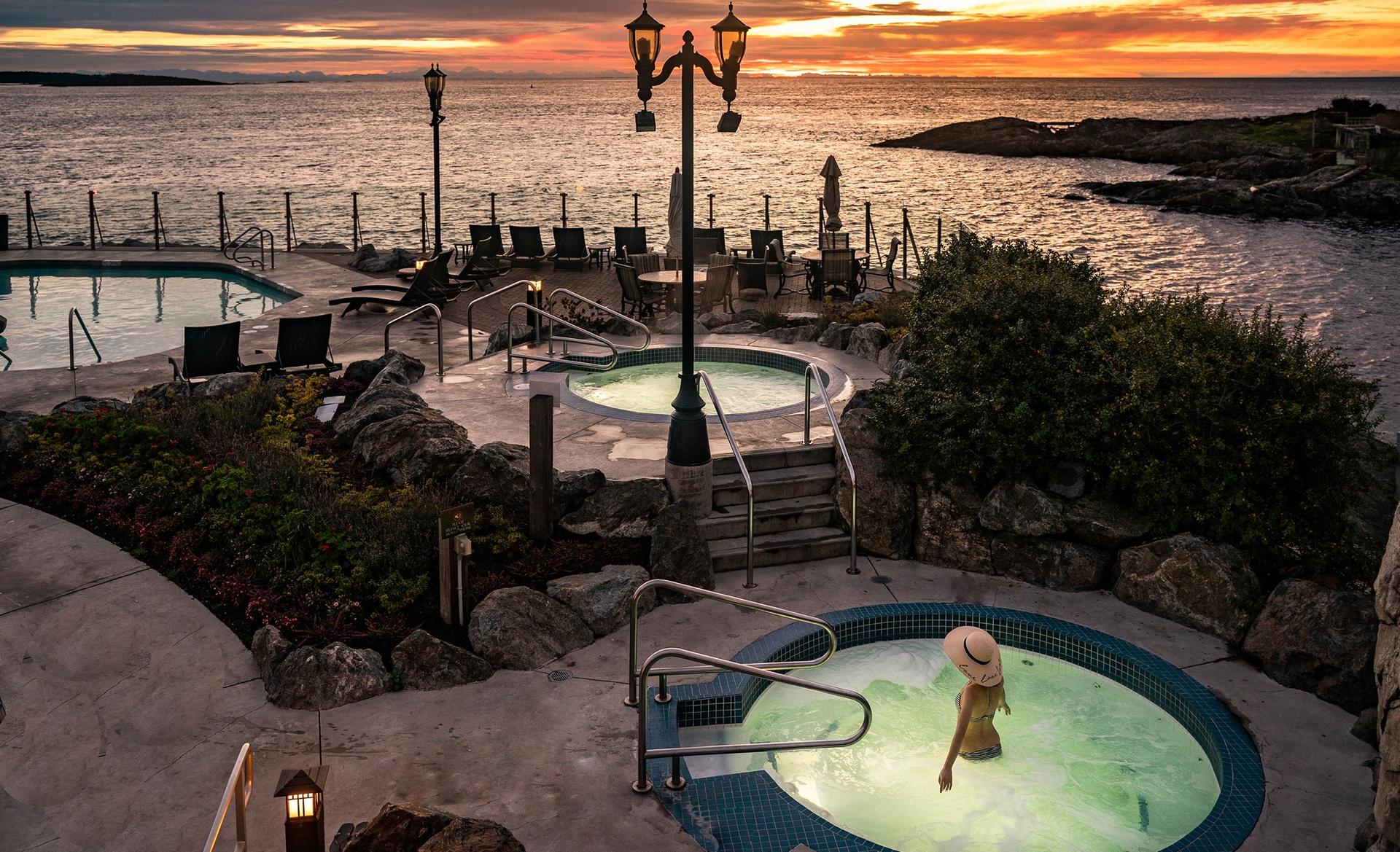 A woman soaks in a mineral pool at the Oak Bay Beach Hotel in Victoria, BC