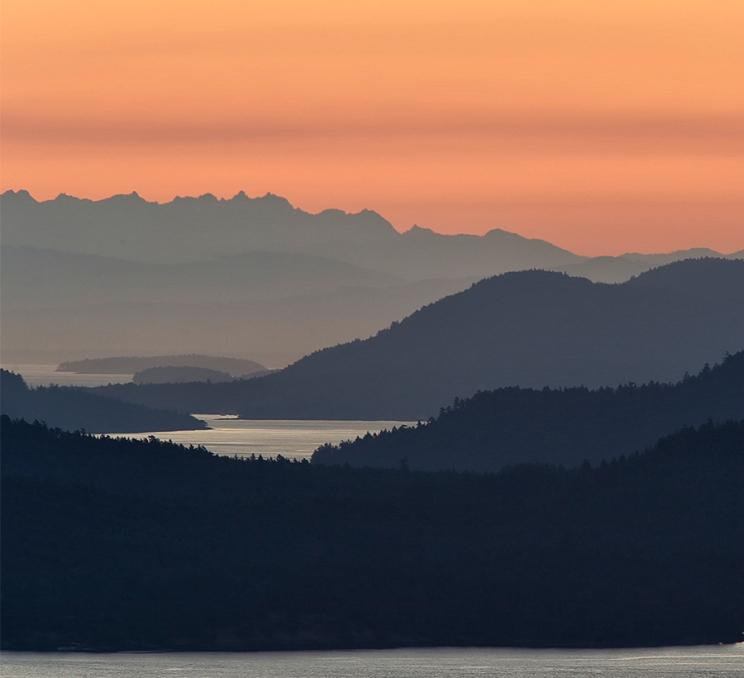 An aerial view of Canada's Southern Gulf Islands at sunset from Greater Victoria, BC