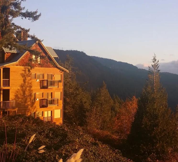 A sunset illuminates Moon Water Lodge on the Malahat just outside of Victoria, BC