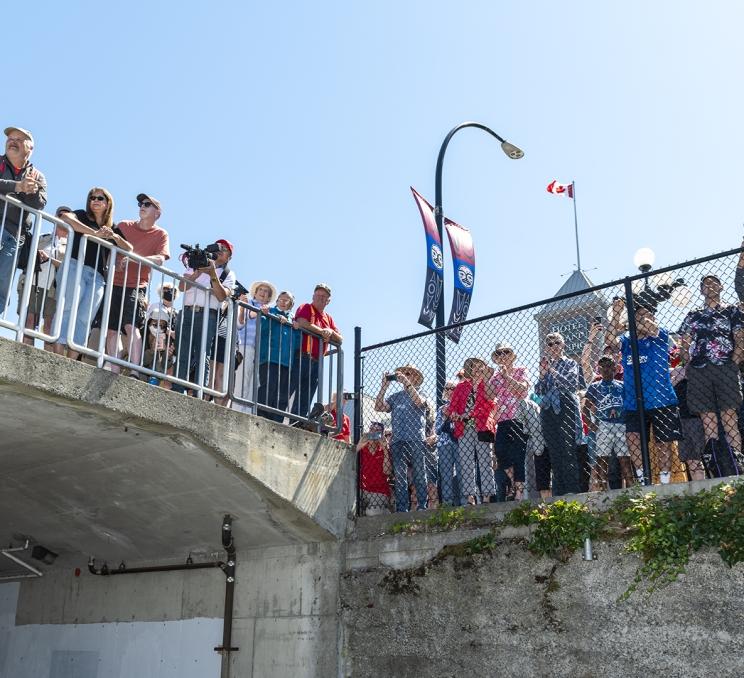 Spectators in Victoria watch the Northwest Deuce Days hotrods disembark from the MV Coho Ferry in 2022.