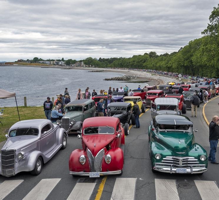 Northwest Deuce Days Ford Deuce Coupes line up along Victoria's Dallas Road to commence their annual Poker Run.