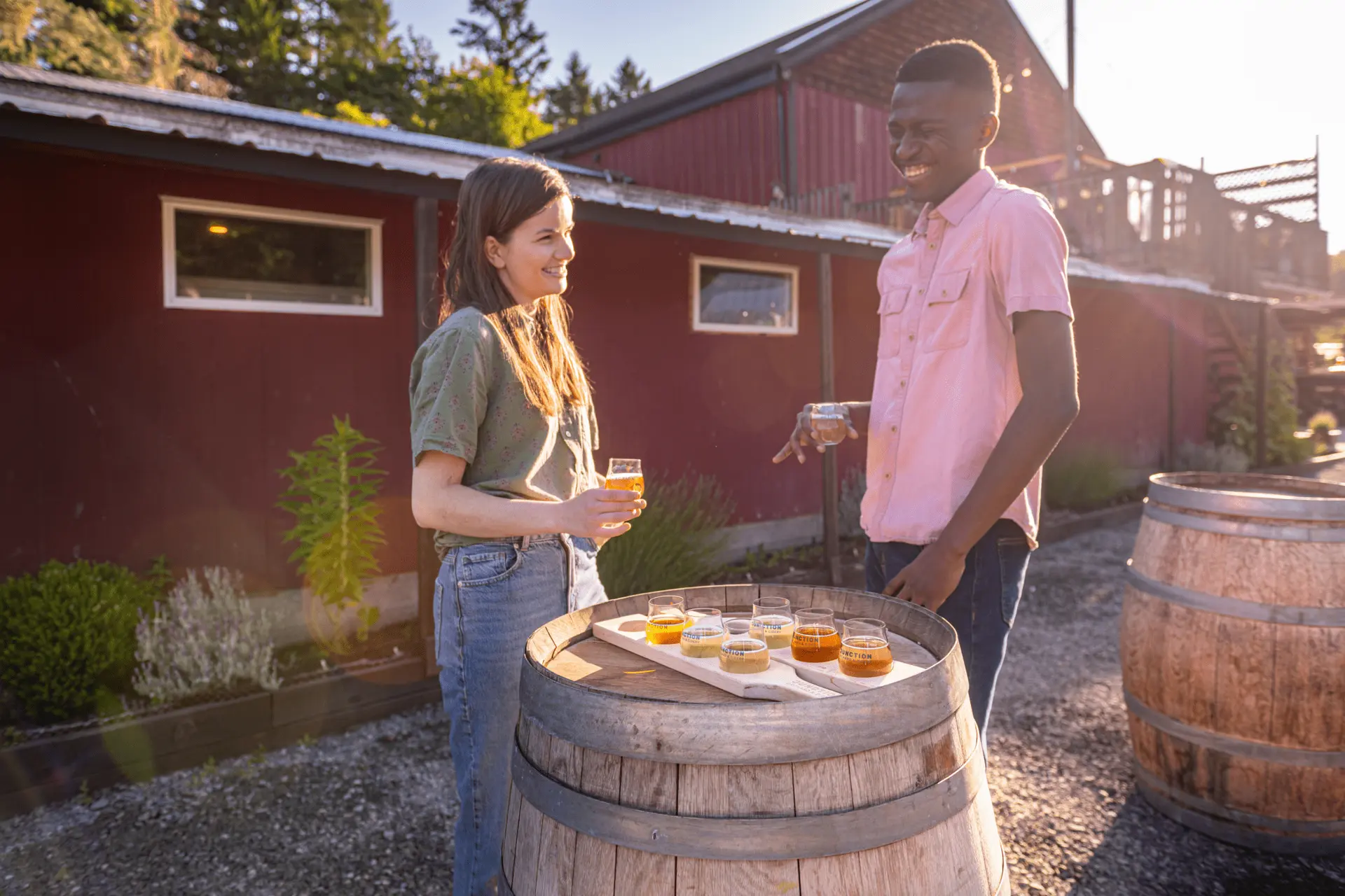 A couple enjoying a cider at a cidery in Victoria, BC