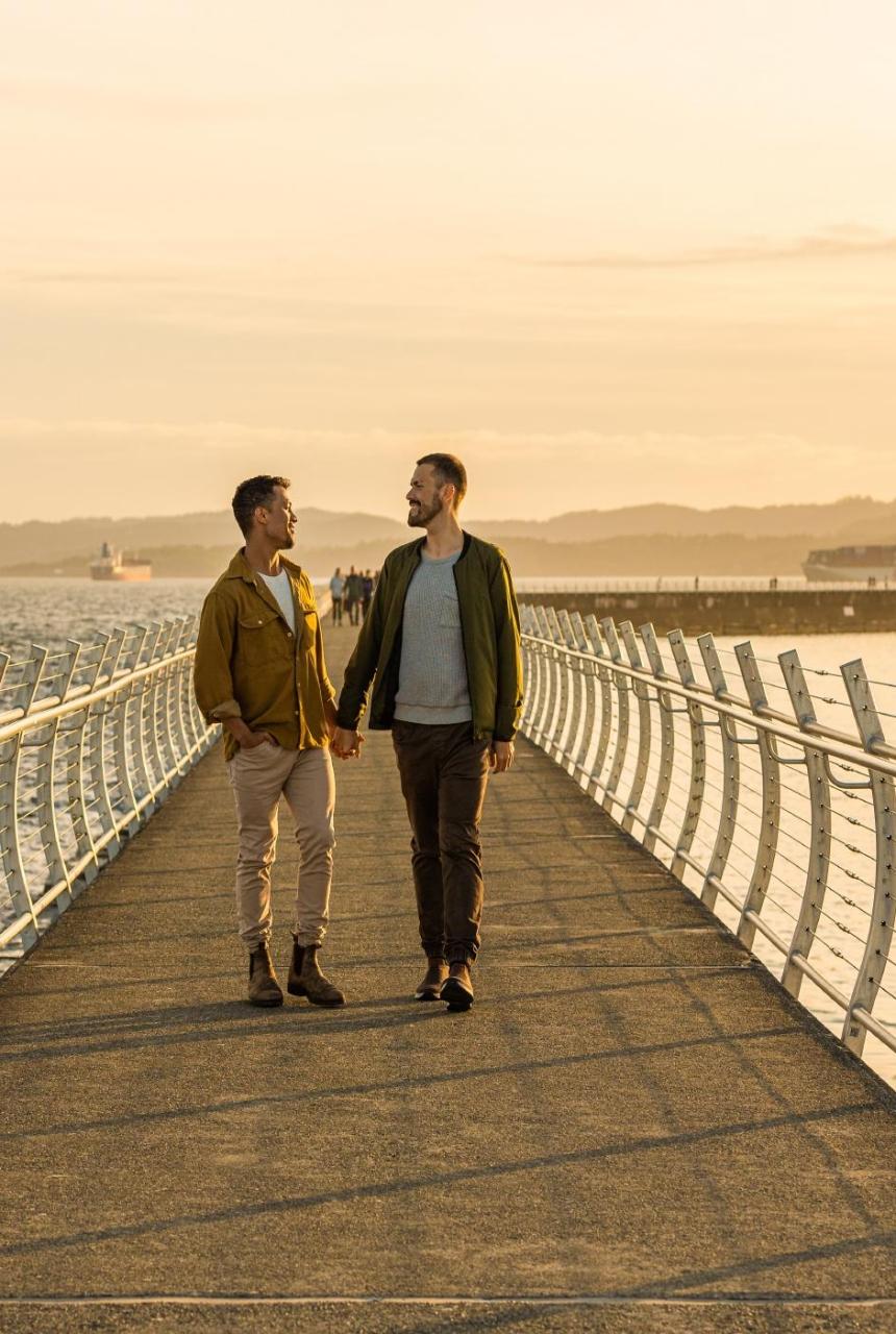 A couple explores Dallas Road in Victoria, BC