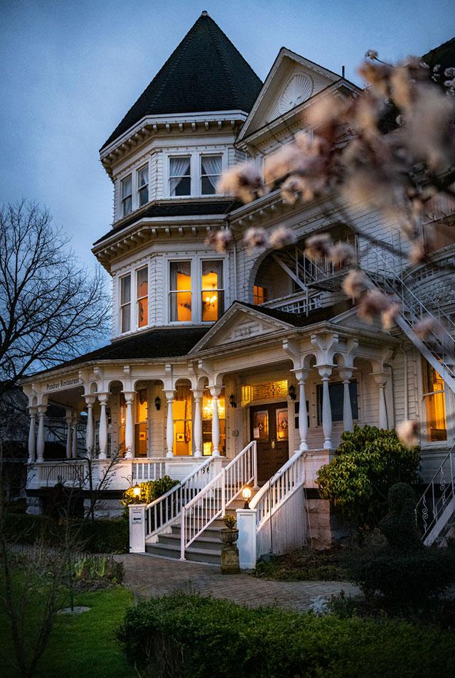 Cherry blossoms bloom in front of the Pendray Inn and Tea House