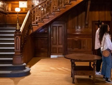 A couple examines artwork in the heritage home wing of the Art Gallery of Greater Victoria in Victoria, BC