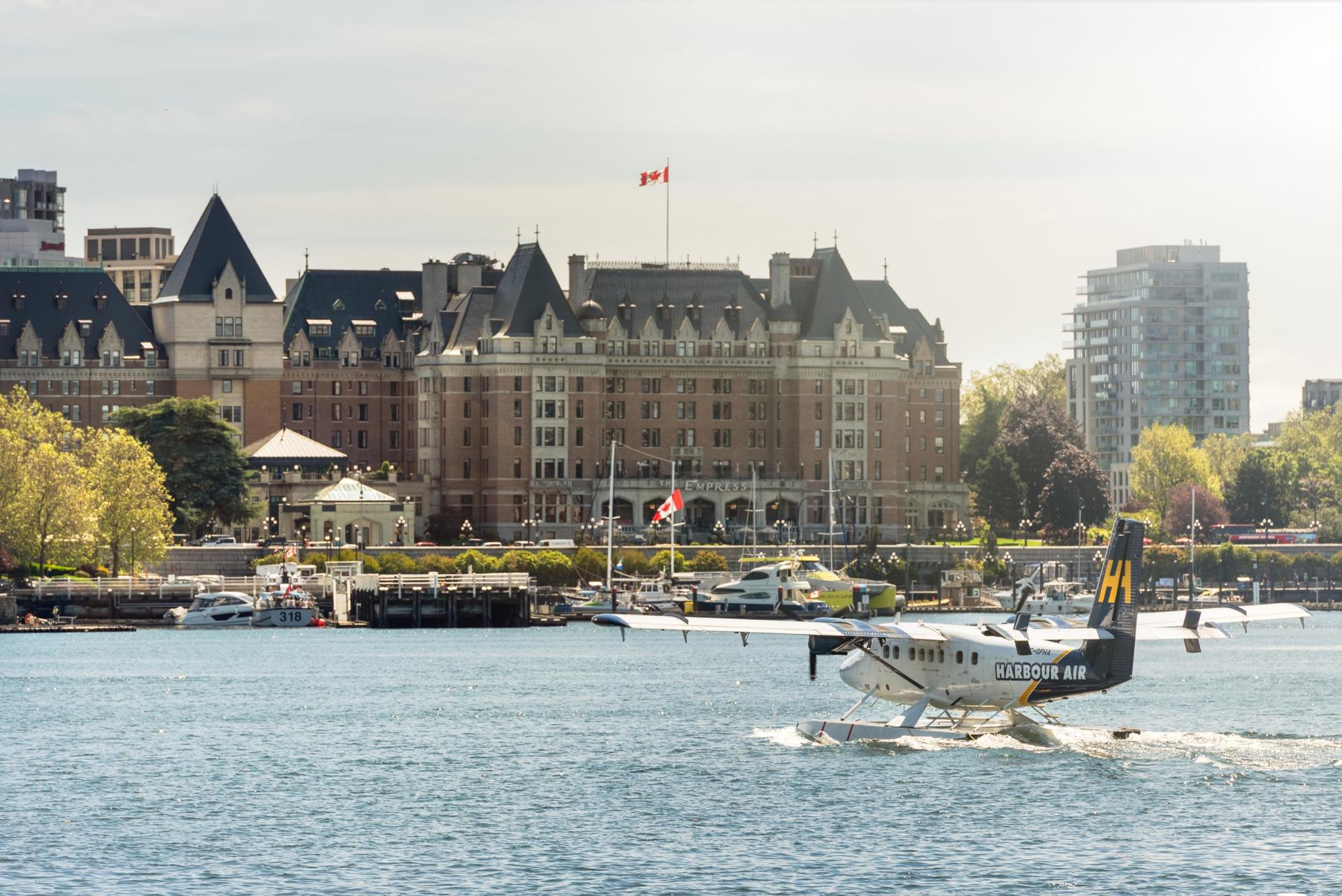 A Harbour Air seaplane lands in Victoria's iconic Inner Harbour