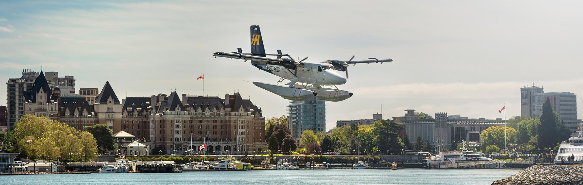 Harbour Air Seaplanes flight lands on the Inner Harbour in Victoria, BC