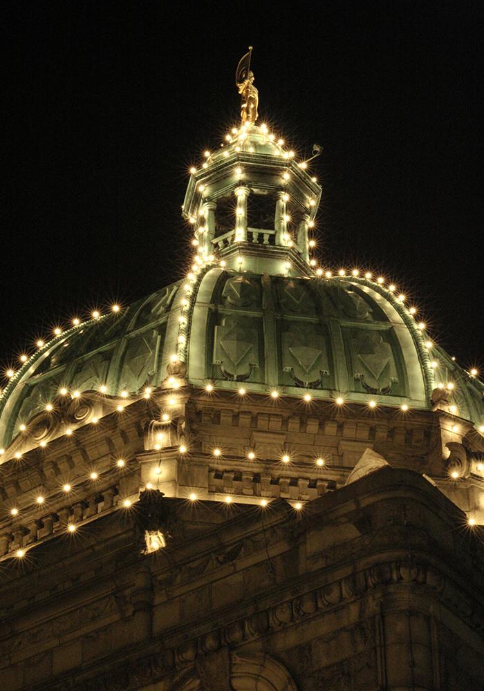 The roof of the BC Parliament Buildings illuminated at night in Victoria, BC